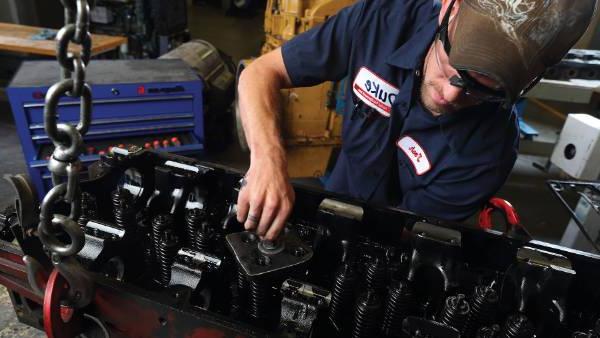 Man working on a diesel engine